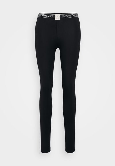 Black leggings made of stretchy fabric with a fitted design, featuring a branded elastic waistband displaying "Emporio Armani."