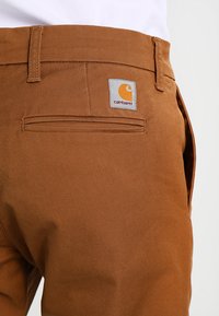Carhartt WIP SID PANT - Calças - hamilton brown rinsed