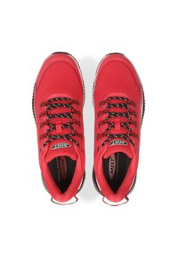 Red athletic shoes with a mesh upper, black laces, and a thick rubber sole. Features MBT branding and a rounded toe design.