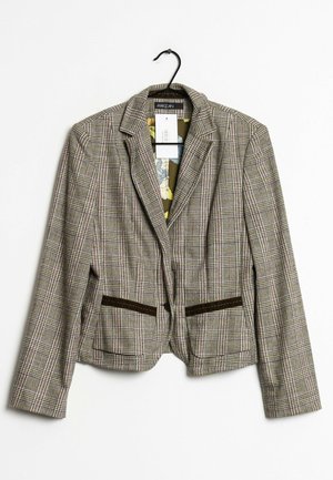 Blazer a quadri in tessuto marrone, beige e bordeaux. Presenta due tasche con dettagli marroni, colletto a revers e fodera interna con motivo.