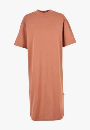 Abito oversize a maniche corte in un morbido colore terracotta. Realizzato in cotone liscio, presenta un collo alto e senza chiusure visibili.