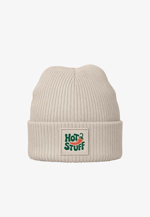 Knit beanie in light beige with a folded cuff. Features a green and red "HOT STUFF" logo on a cream label. Soft texture, ribbed design.