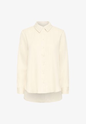 Kreemivärviline pika varrukaga pluus, millel on terav krae, nööbiga esiosa ja veidi kõver hem, valmistatud kergest tekstureeritud kangast.