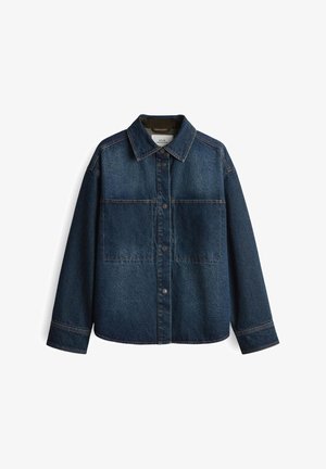 Denim jacket in dark blue with a button-up front, two chest pockets, and classic collar. Features visible stitching and an oversized fit.