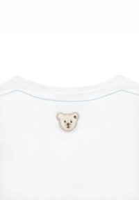 Weißes Kurzarmhemd mit einem hellblau gestickten Ausschnitt und einem kleinen gestickten Eisbärengesicht auf der Rückseite.