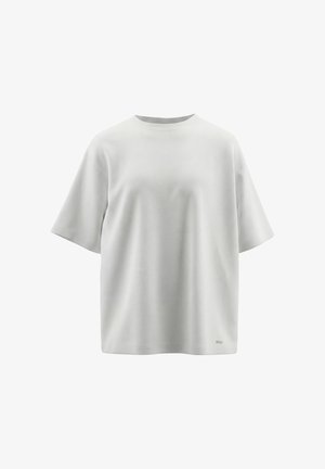 Simpel lysegrå oversized T-shirt med korte ærmer, rund halsudskæring og lille rektangulært metalmærke nær den nederste kant på hvid baggrund.