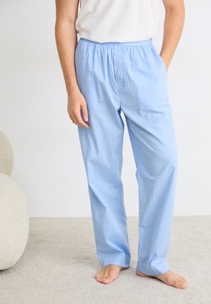 Pantaloni da pigiama azzurri chiari con un motivo a griglia, dotati di una vita elastica e design a gamba dritta, realizzati in un tessuto morbido.