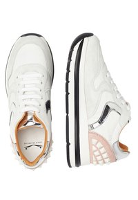White suede and leather sneakers with silver accents, orange lining, black sole, and textured back with spikes. Rounded toe design.