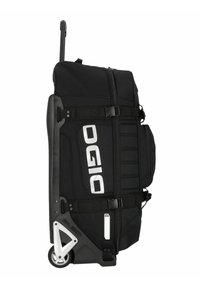 Bolsa de viaje negra con ruedas, mango lateral, correas ajustables y un gran logo exterior. Tela texturizada con acentos estriados.