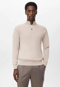Light beige pullover with a half-zip collar, made from a smooth knit material. Features raglan sleeves and a fitted waistband.