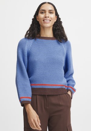 Blue knitted sweater with a textured pattern, brown ribbed cuffs and hem, featuring red horizontal stripes near the hem.