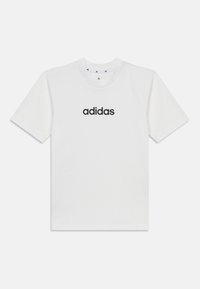 Valkoinen puuvillapaita, jossa on musta "adidas"-logo keskitettynä etupuolelle. Lyhyet hihat ja pyöreä kaula-aukko. Yksinkertainen, klassinen muotoilu.