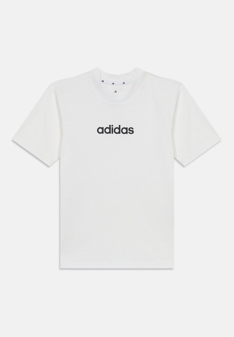 Valkoinen puuvillapaita, jossa on musta "adidas"-logo keskitettynä etupuolelle. Lyhyet hihat ja pyöreä kaula-aukko. Yksinkertainen, klassinen muotoilu.