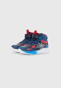 Children’s high-top sneakers in navy blue, red, and white with spiderweb graphic and Velcro strap on a white background.