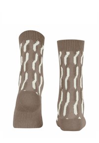 Braune gestrickte Socken mit einem wellenförmigen weißen Muster. Die Bündchen sind gerippt und das Material scheint weich mit einer strukturierten Oberfläche zu sein.