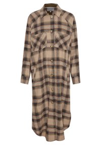 Rutig skjortklänning i mjukt tyg i beige, bruna och blå toner. Har två fickor framtill och knappstängning. Långa ärmar.