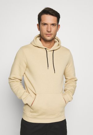 Beige capuchon sweatshirt van zachte stof, met een kangoeroezak, zwarte koordjes en ribgebreide manchetten en zoom.