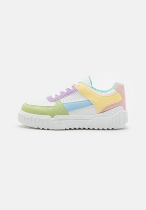 Multicolored sneaker featuring a white base with green, purple, blue, yellow, and pink accents. Smooth texture, lace-up design, and thick sole.