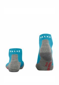 Calze turchesi e grigie con design a costine. Presentano il logo bianco "FALKE" sul lato e dettagli rossi sul tallone per una maggiore aderenza.