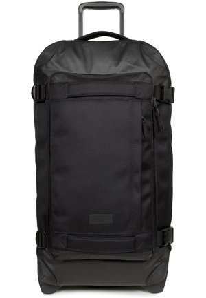 Black rolling duffel bag with a textured surface, top handle, adjustable straps, and front zippered pocket. Durable material with reinforced base.