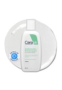 CeraVe foaming cleanser in a white bottle with a green label, featuring a flip-top lid, placed on a clear gel puddle. 88 ml size.