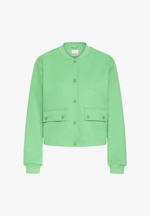 Green cropped jacket in soft fabric, featuring a round neckline, snap front, and two front pockets with flap closures.