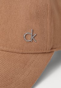 Calvin Klein Caps - amphora