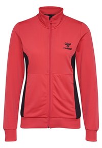 Veste de sport rouge avec fermeture éclair à l'avant, col montant, panneaux latéraux noirs et logo Hummel sur la poitrine. Confectionnée en matériau lisse et léger.