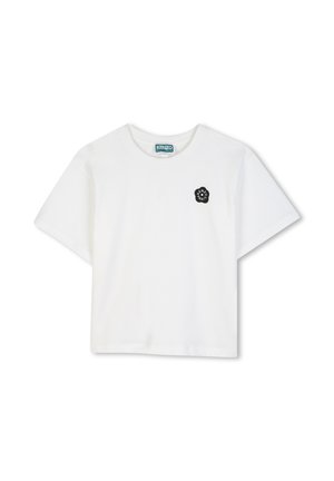 T-shirt blanc à manches courtes, col rond et petit logo fleur noir avec le texte "Kenzo Paris" sur la poitrine gauche.