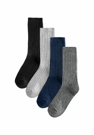 Cztery pary skarpetek z żebrowanym wzorem: czarne, jasnoszare, ciemnoniebieskie i ciemnoszare. Wykonane z miękkiego materiału, każda skarpetka ma wygodny ściągacz.
