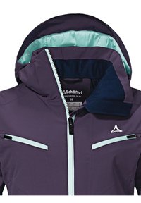 Fialová nepromokavá bunda s tyrkysovou podšívkou, nastavitelnou kapucí, kontrastními zipy a dvěma zipovými předními kapsami pro ukládání.