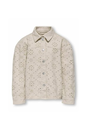 Veste en denim beige clair avec des motifs découpés floraux, boutons argentés et col. Manches longues et détails de couture.