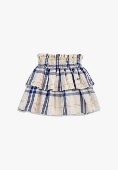 Jupe à carreaux blanc et bleu avec une taille élastique froncée et un volant superposé autour du haut, présentant de fines lignes orange dans le motif.