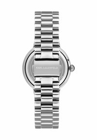 Silverfärgad metallklocka med en slät, rund urtavla, ett kraftigt länkarmband och en minimalistisk urtavla med märket "KARL LAGERFELD."