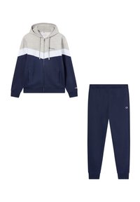 Hoodie grigio e blu navy con zip, striscia bianca, tasche anteriori; pantaloni sportivi abbinati blu navy con vita elastica e logo ricamato sull'anca.