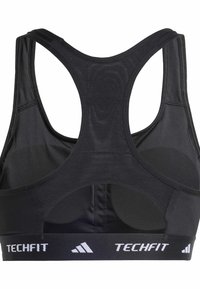Svart trenings-BH med racerback-design, laget av glatt stoff. Inkluderer en stretch-band merket "TECHFIT" og mesh-detaljer.