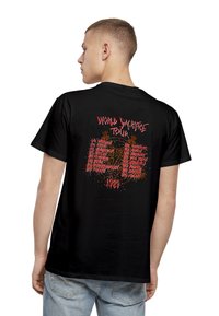 Black cotton t-shirt featuring "World Sacrifice Tour" graphic in red and white on the back with tour dates and a circular design element.