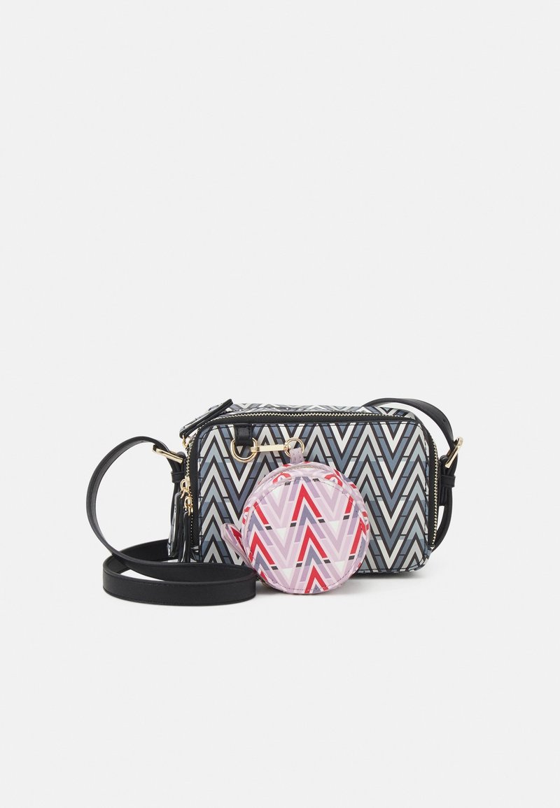 Zippered bag with a black and white chevron pattern, featuring a detachable round coin pouch in pink and red geometric design. Black strap.