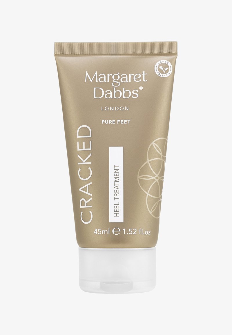 Behandlung für rissige Fersen in einer goldenen Tube mit weißer Schrift und Klappdeckel. Enthält 45 ml Produkt. Vegan-freundliches Etikett sichtbar.