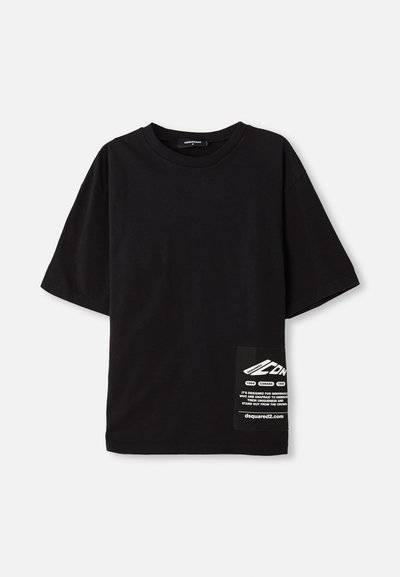 Black oversized t-shirt made of cotton, featuring short sleeves, a round neckline, and a label with white text on a side patch pocket.