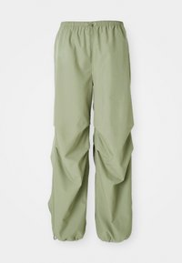 Light green, elastic waistband pants with a loose fit, featuring gathered side detail and cuffs. Made from a smooth fabric.