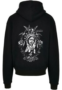 Zwarte hoodie met een gedetailleerde witte grafiek op de achterkant, waarop een figuur met een kroon te zien is, omringd door bloemen en vogels.