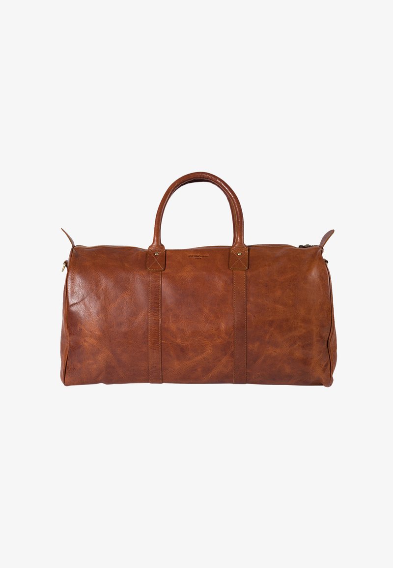 Brown leather duffel bag with a smooth texture, rounded handles, two side straps, and a zipper closure. Features minimalist design and brass hardware.