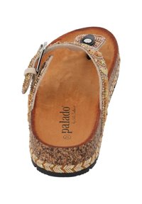 Sandal con soletta in sughero e cinturino beige, decorato con piccole perline e un accento nero, dotato di suola intrecciata e fibbia regolabile.