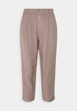 Light beige linen trousers with an elastic waistband and a button closure. Features a relaxed fit and slightly tapered legs.