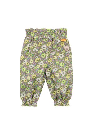 Kinderhose mit Blumenmuster in Grün, Gelb und Lila. Verfügt über einen elastischen Bund und geraffte Knöchel. Mit einem Bärenaufnäher versehen.