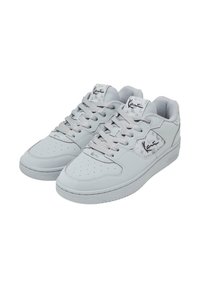 Light gray sneakers made of smooth leather with a perforated toe, featuring matching laces and subtle branding detail on the tongue.