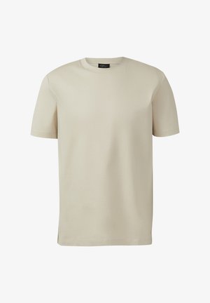 Beżowy t-shirt z krótkim rękawem i okrągłym dekoltem, z prostym dołem i widoczną metką marki wewnątrz kołnierza.