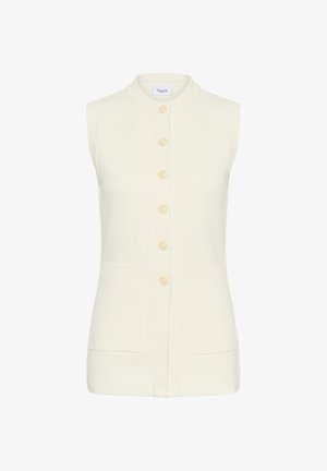 Cardigan crem fără mâneci, cu guler înalt, nasturi în față și două buzunare frontale. Textură moale de tricot, margini tricotate.