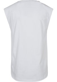 Haut sans manches blanc en coton avec un col rond et une coupe décontractée. Texture lisse, sans motifs ni accents visibles.